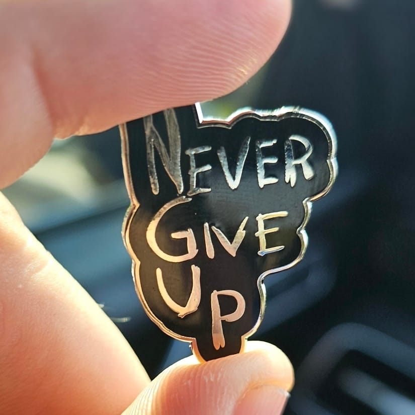 "Never Give Up" Pin